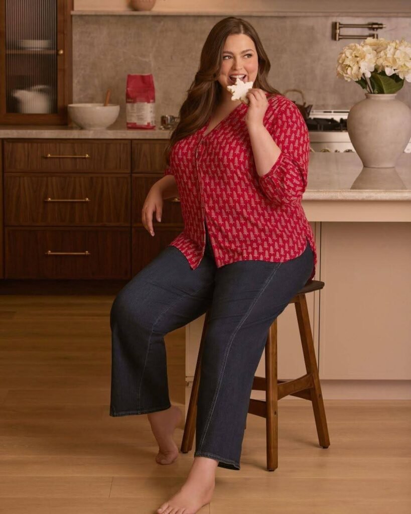 Red Christmas-tree-print blouse with dark jeans